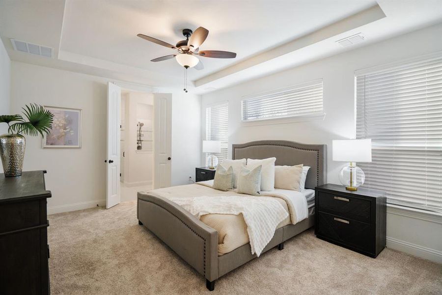 Main level living never looked so good — the roomy primary bedroom is right where you want it.