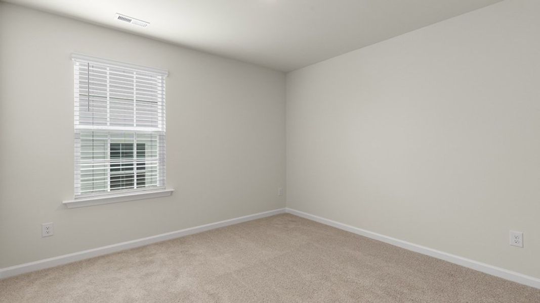 Spacious, unfurnished interior of a new home in The Grove at Matthews Landing, Fuquay Varina (Image 27).