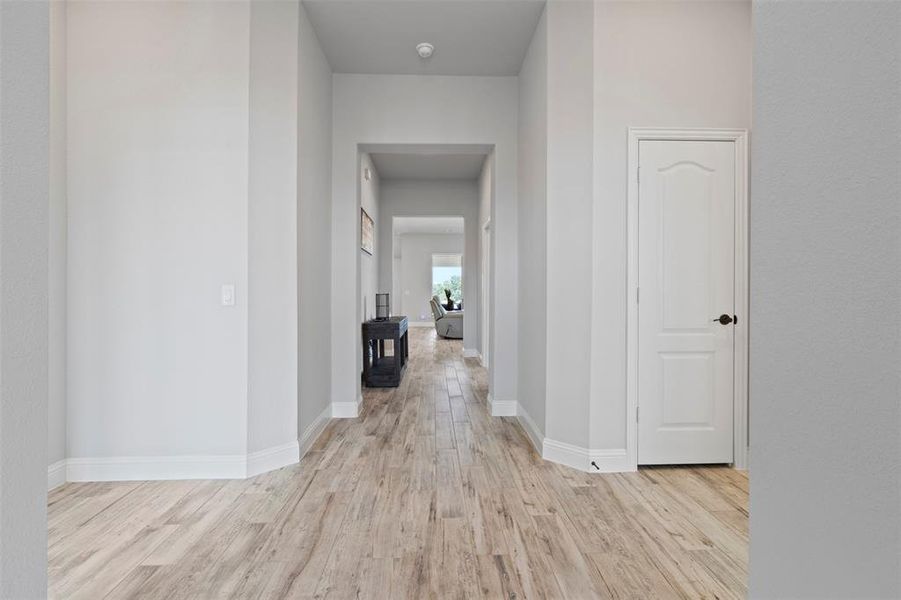 Hallway with light wood-type flooring