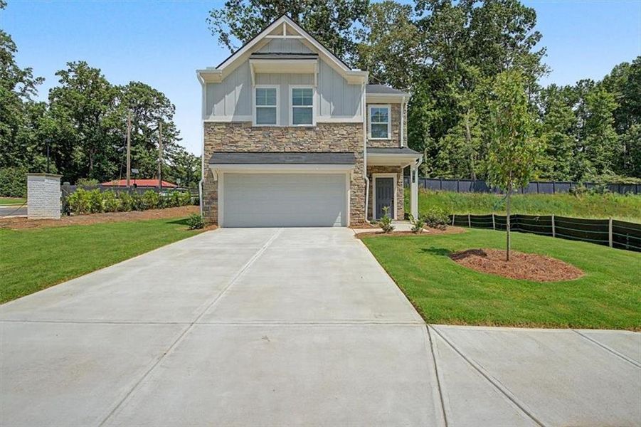 Front exterior of a new home in Sawmill Creek, Mableton, GA, highlighting curb appeal (Image 23).