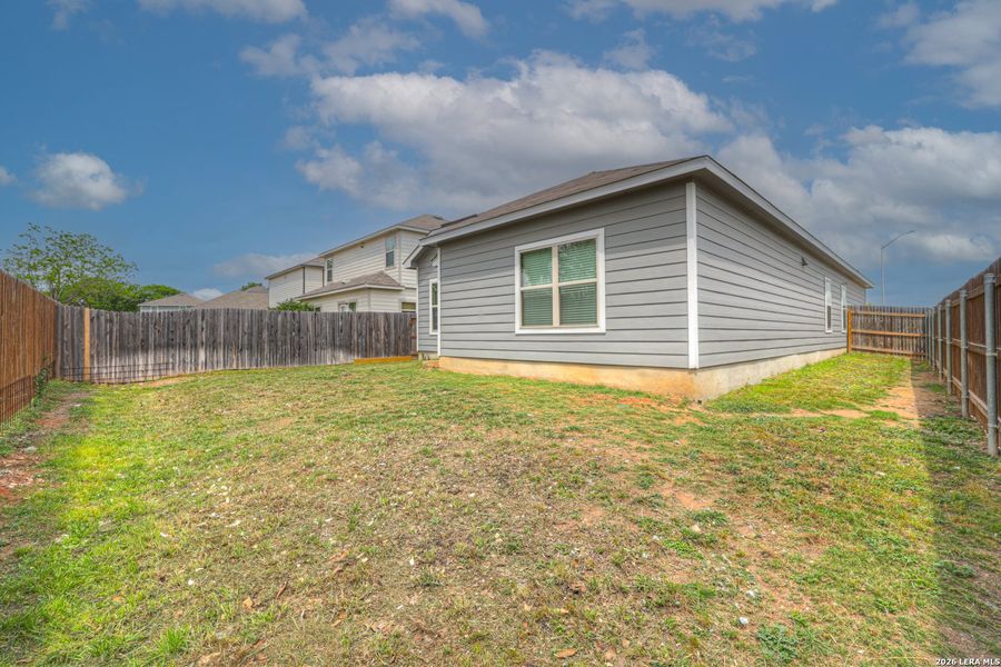 Exterior details and patio area of a home in Meadows of Martindale, Seguin (Image 19).