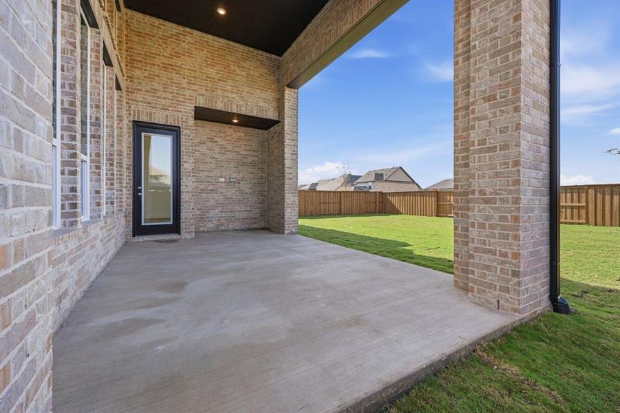 Exterior details and patio area of a home in Mantua Point: 55ft. lots, Van Alstyne (Image 3).