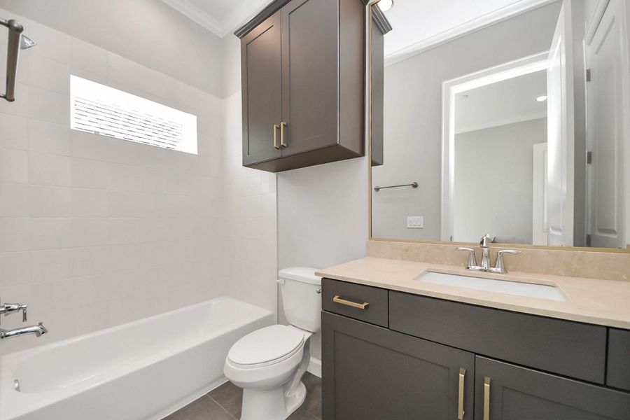 Secondary bathroom with tub/shower combination and vanity. Secondary bathroom with tub/shower combination and vanity.