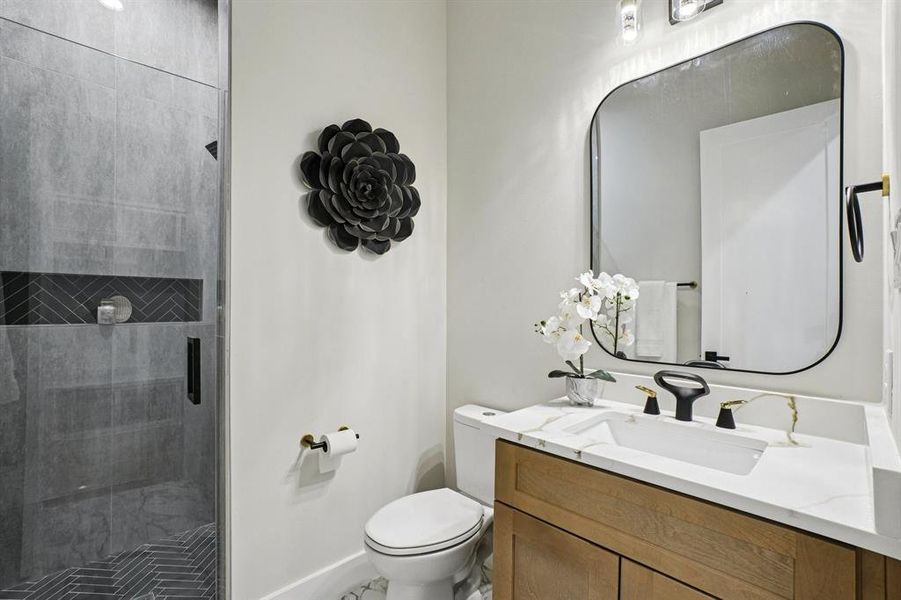 Full bath featuring vanity and a shower stall