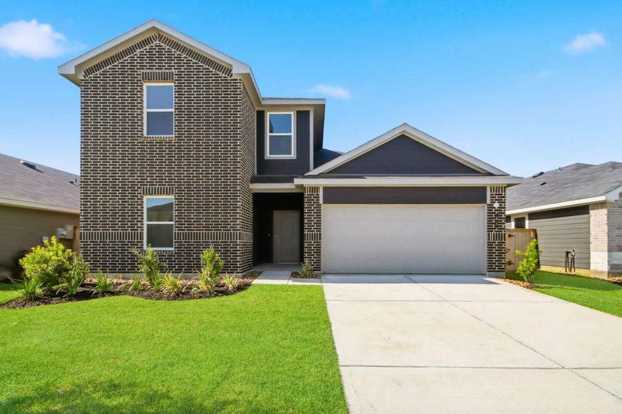 Front exterior of a new home in Maple Woods, Hockley, TX, highlighting curb appeal (Image 2). Front exterior of a new home in Maple Woods, Hockley, TX, highlighting curb appeal (Image 2).