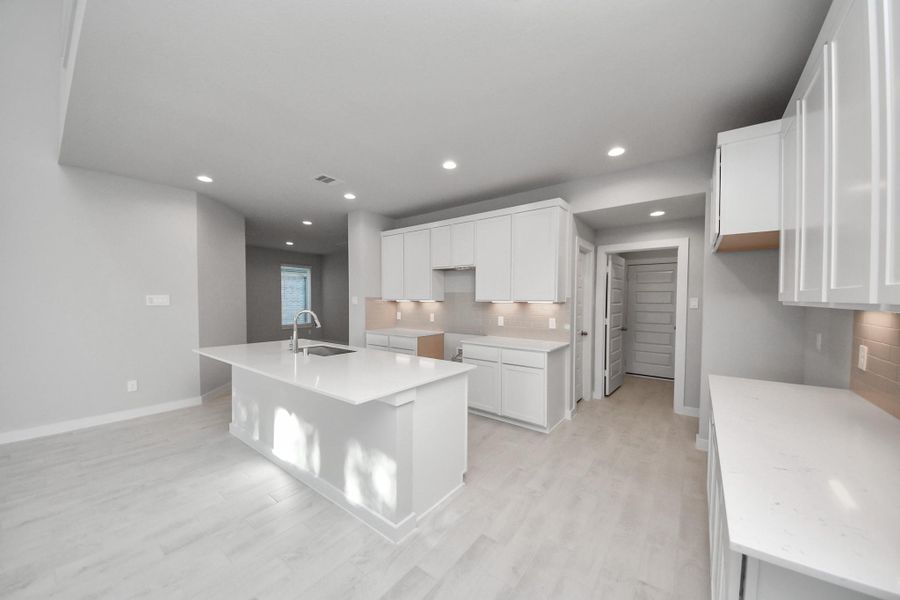 This generously spacious kitchen is a dream realized! Sample photo of completed home with similar floor plan. Actual colors and selections may vary.