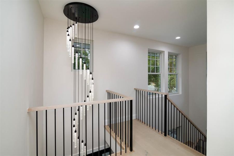 Hallway with light hardwood / wood-style flooring