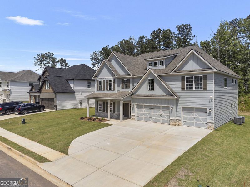 Front exterior of a new home in Juliette Crossing, Forsyth, GA, highlighting curb appeal (Image 2).
