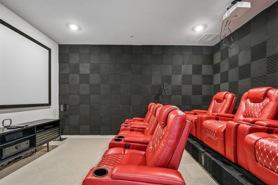 Indulge in cinematic luxury within this dedicated media room, featuring plush stadium seating and integrated soundproofing.