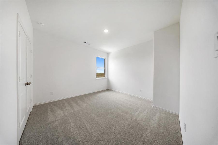 Unfurnished room with light carpet and recessed lighting Unfurnished room with light carpet and recessed lighting