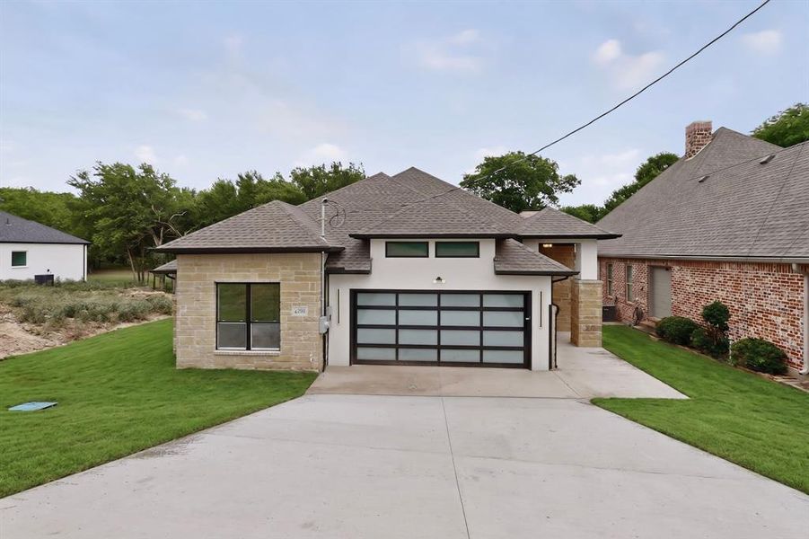 Front exterior of a new home in , Whitney, TX, highlighting curb appeal (Image 20). Front exterior of a new home in , Whitney, TX, highlighting curb appeal (Image 20).