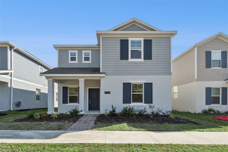 Front exterior of a new home in , St. Cloud, FL, highlighting curb appeal (Image 1). Front exterior of a new home in , St. Cloud, FL, highlighting curb appeal (Image 1).
