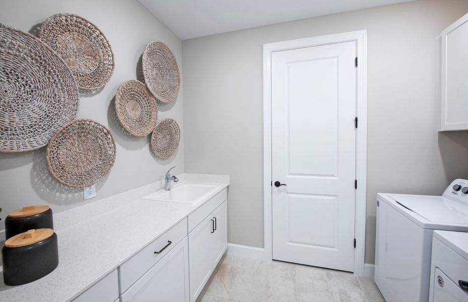 Laundry room with ample storage space Laundry room with ample storage space