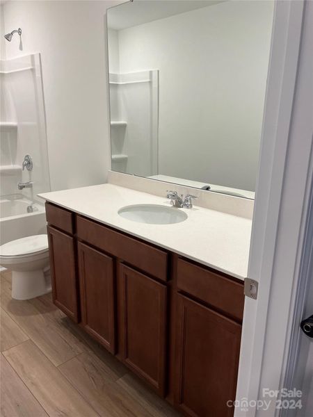 2nd bathroom with stain Cabinets