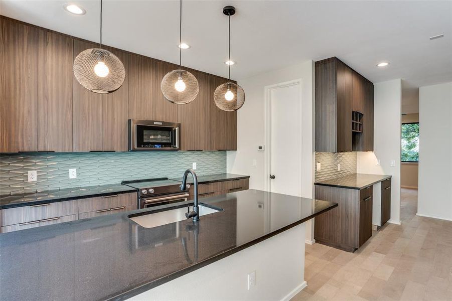 Photos are of unit #204. Unit #101 will feature white cabinets and grey wood floors. Photos are of unit #204. Unit #101 will feature white cabinets and grey wood floors.