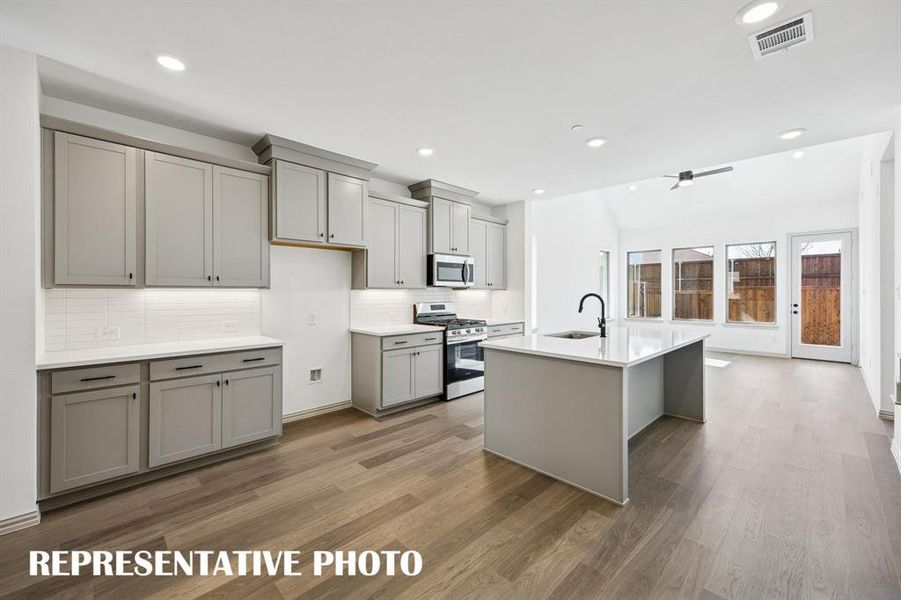 Our Walker floor plan offers a dream kitchen featuring outstanding storage and prep space!  REPRESENTATIVE PHOTO