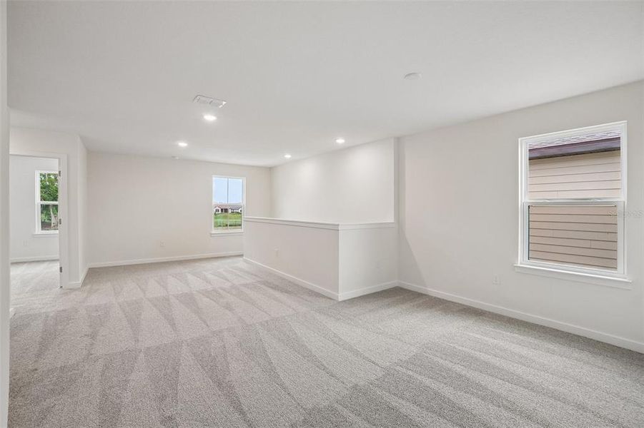 Spacious, unfurnished interior of a new home in Grasslands West, Lakeland (Image 36).