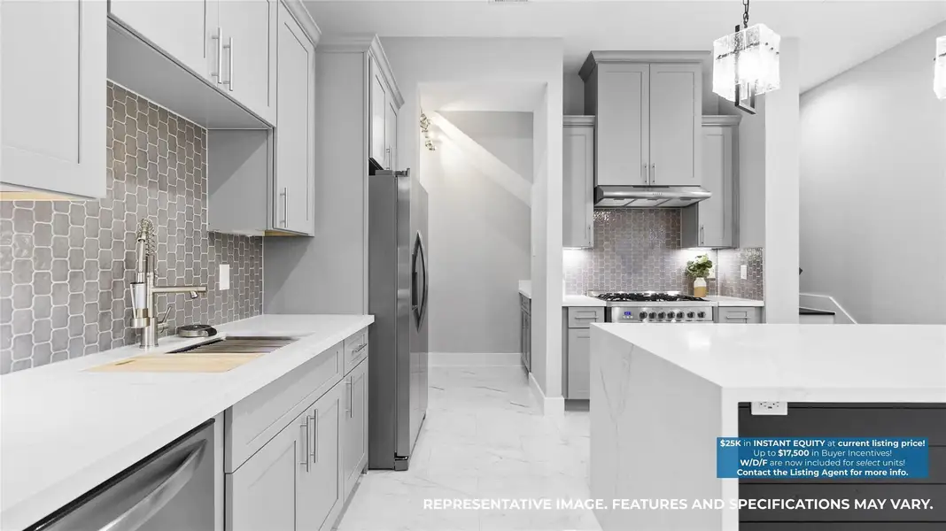 This angle shows how effortlessly your kitchen works day to day, with generous counter space, a deep sink, and sleek stainless appliances right where you need them. The tiled backsplash adds texture without overpowering the space, making meal prep, hosting, and everyday routines feel streamlined and intentional. This angle shows how effortlessly your kitchen works day to day, with generous counter space, a deep sink, and sleek stainless appliances right where you need them. The tiled backsplash adds texture without overpowering the space, making meal prep, hosting, and everyday routines feel streamlined and intentional.