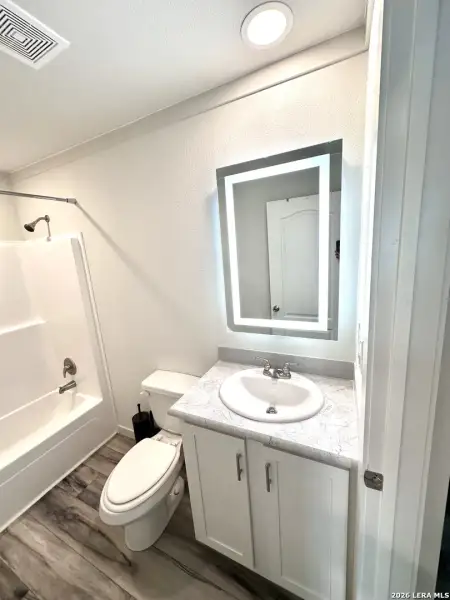 Furnished interior view inside a new home in , Lakehills (Image 4).