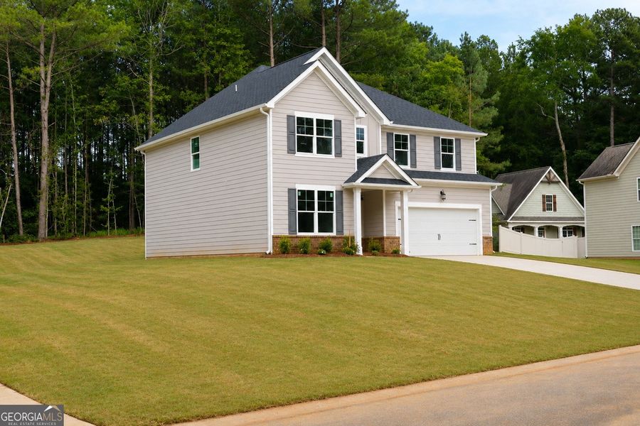 Front exterior of a new home in Stone Brooke, Gray, GA, highlighting curb appeal (Image 20).