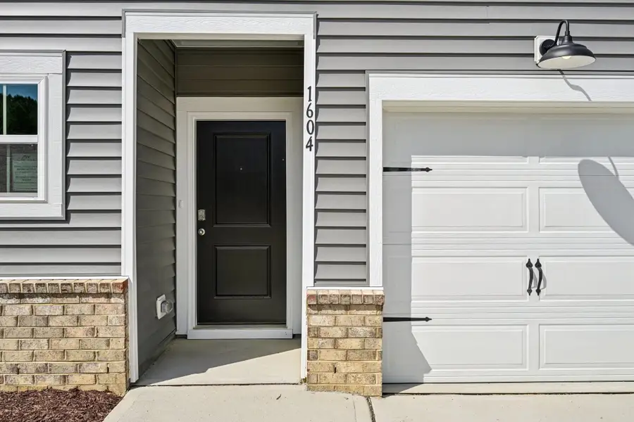 Exterior details and patio area of a home in Towns at The Point, Rolesville (Image 3).