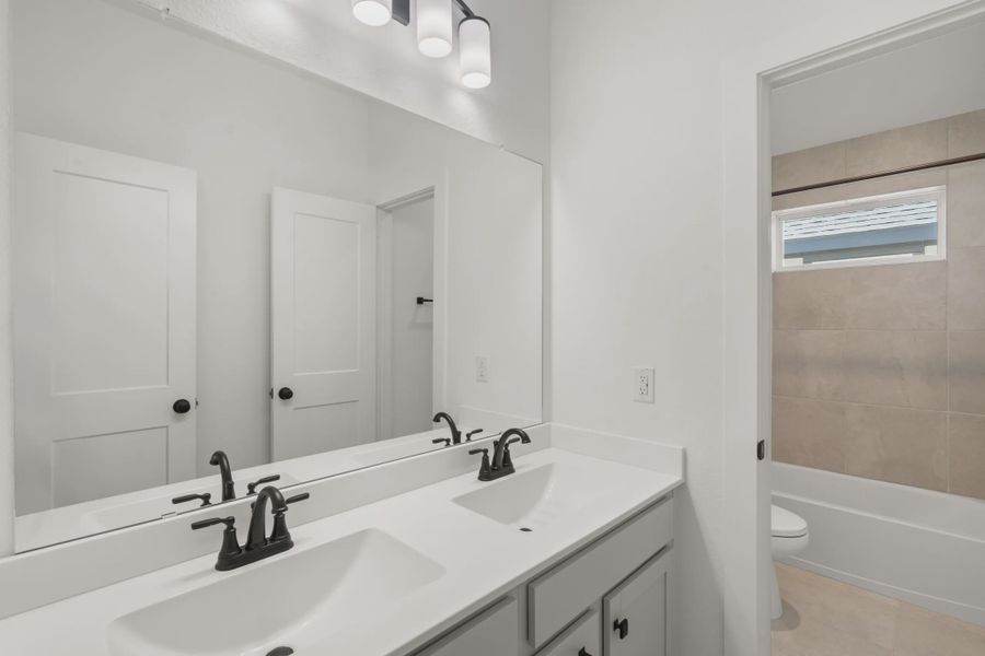 Furnished interior view inside a new home in The Woodlands Hills, Willis (Image 11).