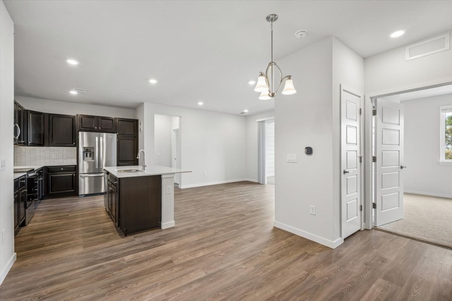A kitchen with wooden floors.
