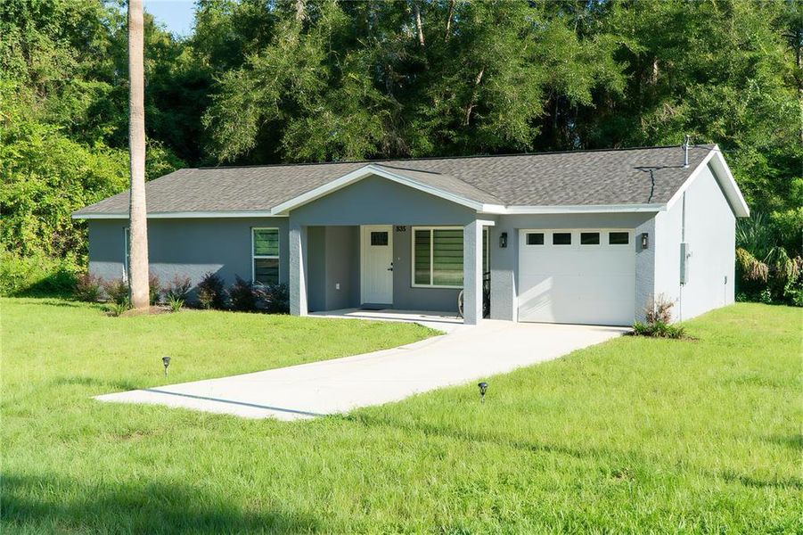 Front exterior of a new home in , Citra, FL, highlighting curb appeal (Image 20). Front exterior of a new home in , Citra, FL, highlighting curb appeal (Image 20).