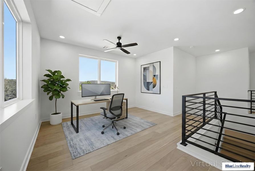 Office space with light wood-style flooring, a ceiling fan, and recessed lighting