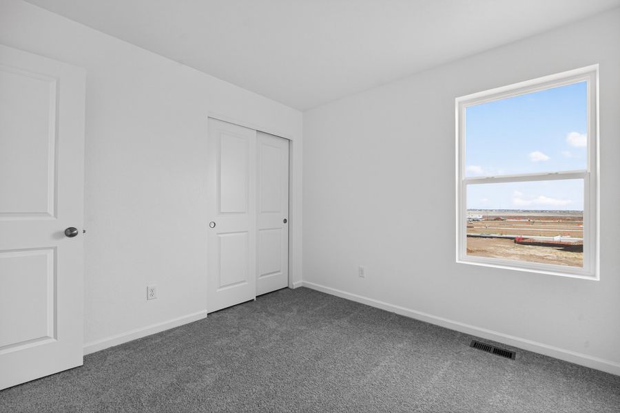 Spacious, unfurnished interior of a new home in Sky Ranch, Watkins (Image 18).