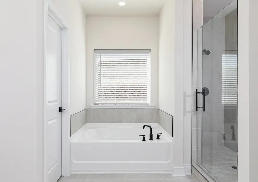 Fall in love with the large soaking tub and walk-in shower in the master bathroom