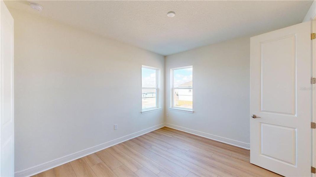 Spacious, unfurnished interior of a new home in Laureate Park, Orlando (Image 13).