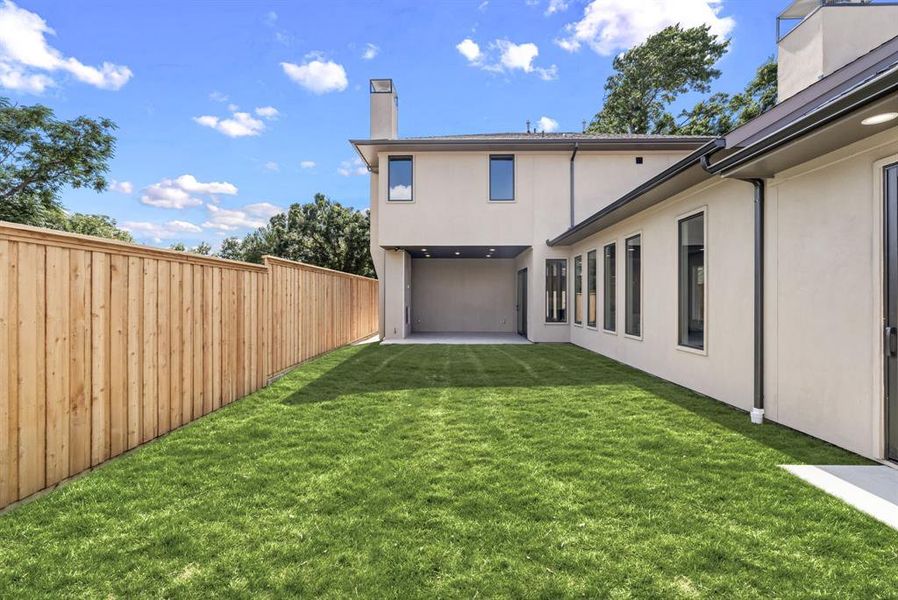 Back of property featuring stucco siding, a chimney, and a patio Back of property featuring stucco siding, a chimney, and a patio