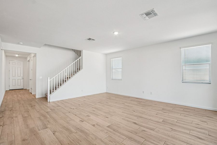 Great room. Finishes and options may vary by community.