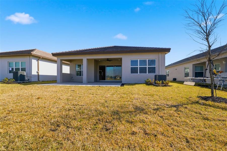 Exterior details and patio area of a home in Valencia Ridge, Wesley Chapel (Image 19).