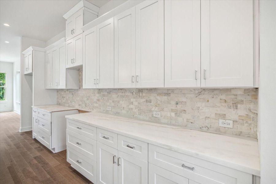 Cabinets to the Ceiling * Marble Backsplash * Under Cabinet Lighting. Cabinets to the Ceiling * Marble Backsplash * Under Cabinet Lighting.