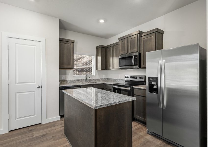 The kitchen has stainless-steel, energy-efficient appliances.
