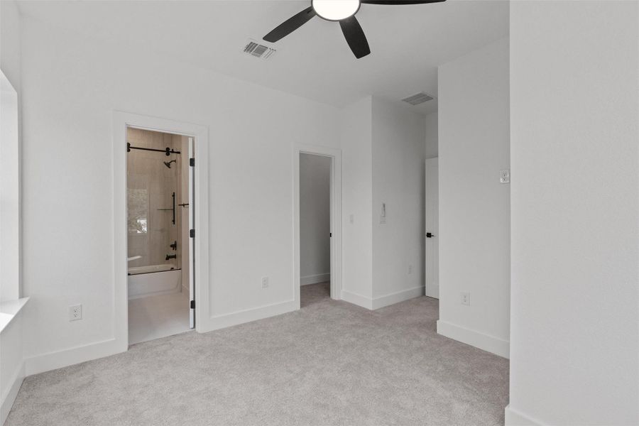 Bedroom #2 with plush carpet and plenty of natural light. This room has it's on en suite bath. Bedroom #2 with plush carpet and plenty of natural light. This room has it's on en suite bath.