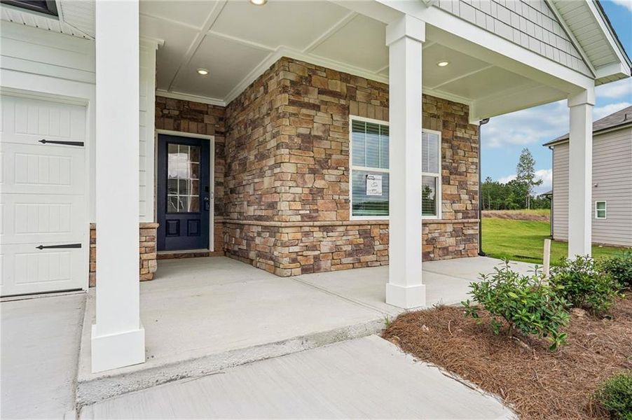 Exterior details and patio area of a home in Northwoods at Mirror Lake, Villa Rica (Image 30).