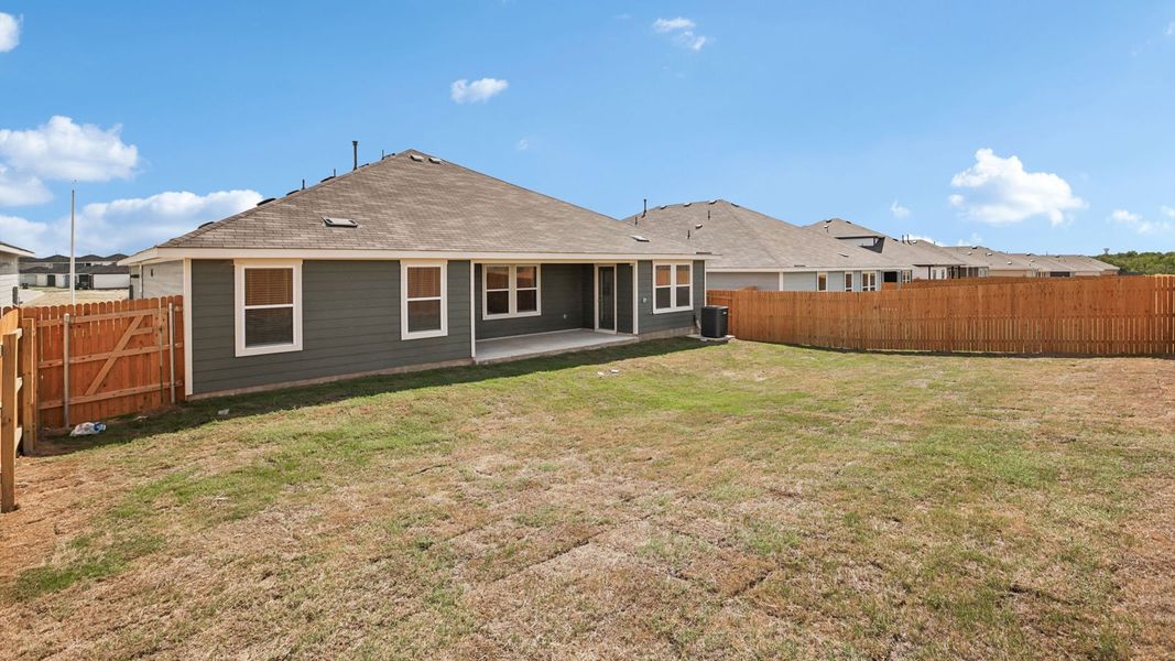 Exterior details and patio area of a home in Prairie Lakes, Buda (Image 24).