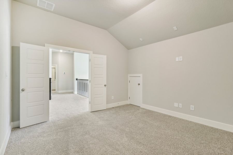 Guest bedroom in the Cedar floorplan at a Meritage Homes community.