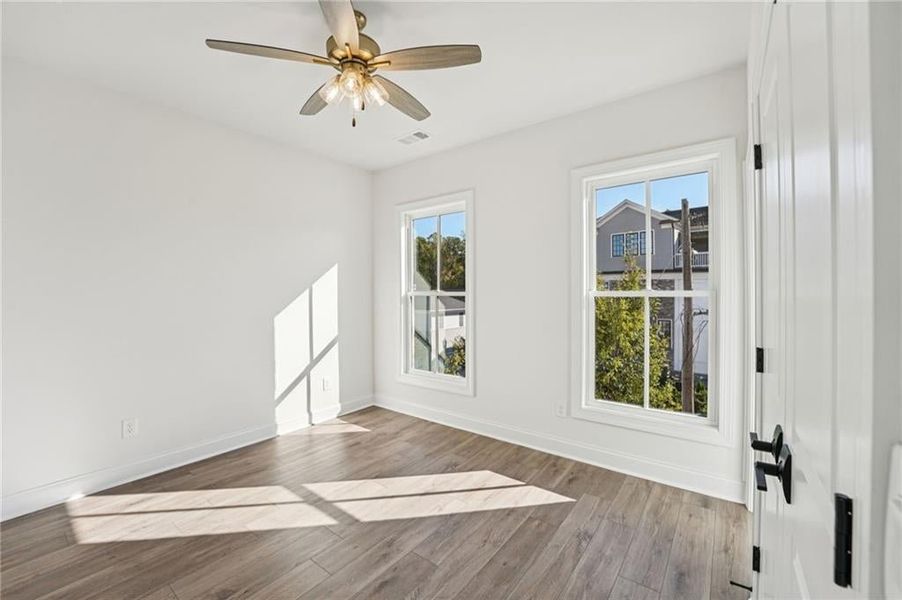 Secondary bedroom on 3rd floor- just look at all the natural light that comes through the large windows.  Image is of previously built home.