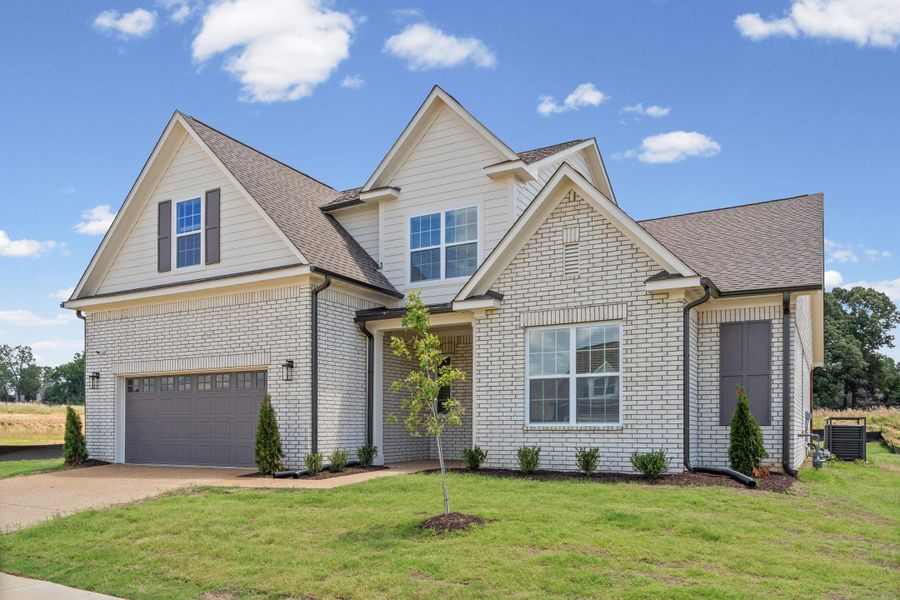 Contemporary two-story residence featuring light brick and horizontal siding Contemporary two-story residence featuring light brick and horizontal siding