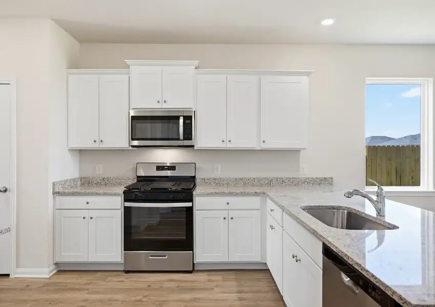 Kitchen with stainless range and undermount sink in Montgomery floor plan
