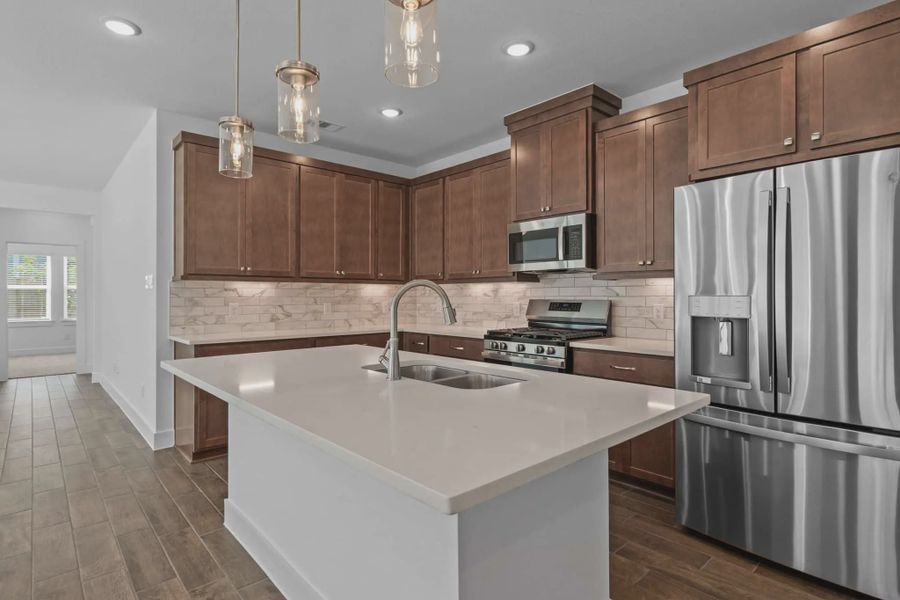 Representative furnished interior of a home built from the Carriagehouse by Chesmar Homes in Meridiana Townhomes, Iowa Colony (Image 16).