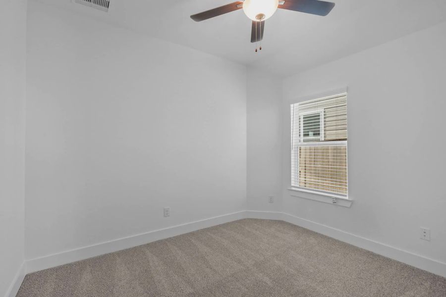 Representative unfurnished interior of a home built from the Carriagehouse by Chesmar Homes in Meridiana Townhomes, Iowa Colony (Image 80).