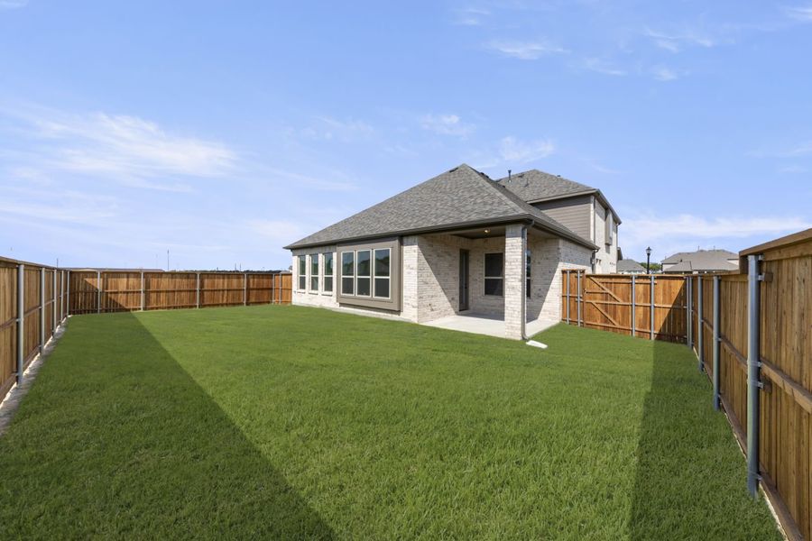 Exterior details and patio area of a home in River Ranch, Van Alstyne (Image 19).