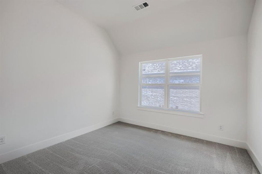 White-painted walls with matching trim and light gray patterned carpeting White-painted walls with matching trim and light gray patterned carpeting