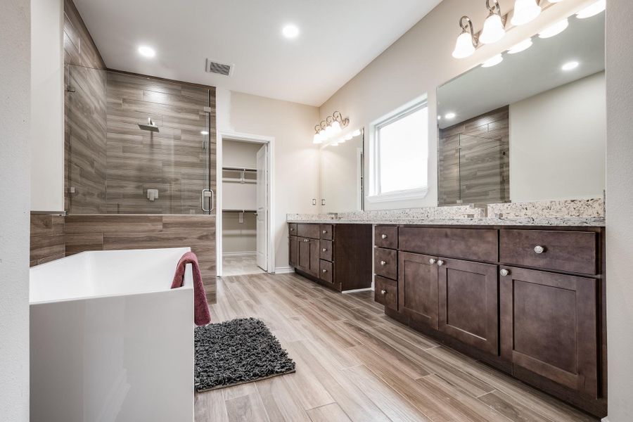 Soaking tub and walk-in shower with modern tile. Soaking tub and walk-in shower with modern tile.