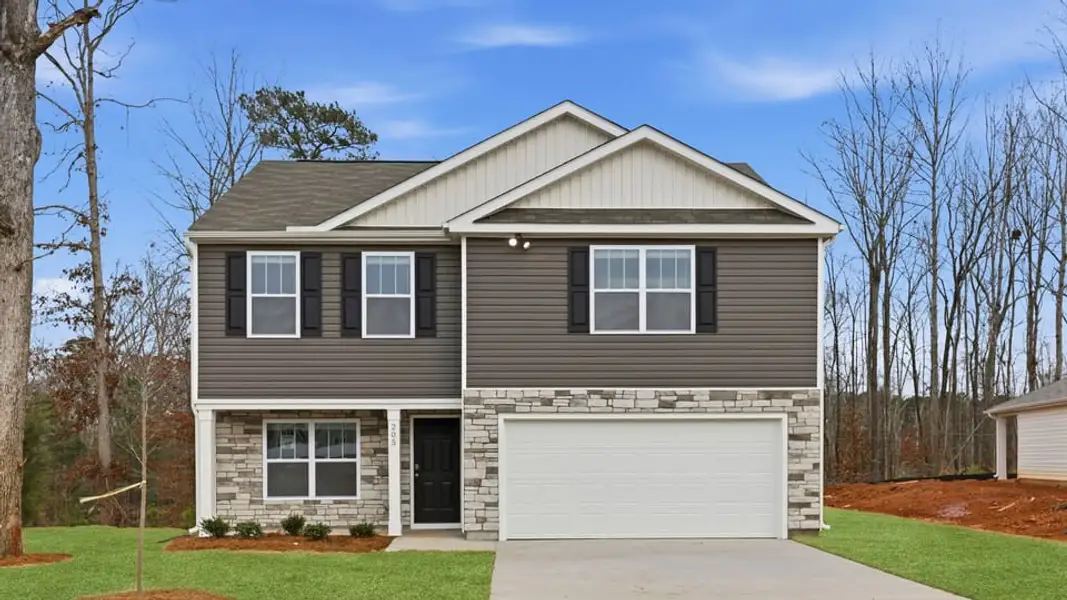 Front exterior of a new home in Cedar Gap, Fountain Inn, SC, highlighting curb appeal (Image 1). Front exterior of a new home in Cedar Gap, Fountain Inn, SC, highlighting curb appeal (Image 1).